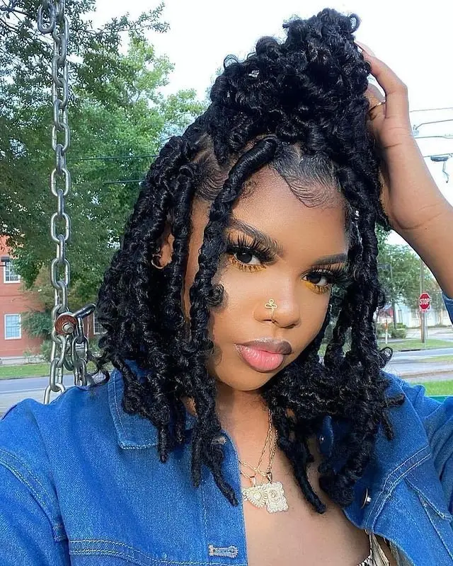 Half-up goddess cornrows transitioning into loose, wavy lengths