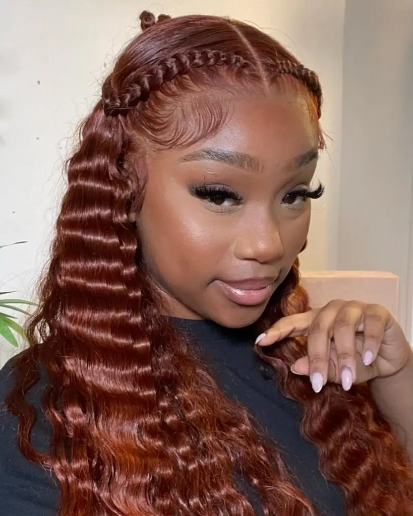 Goddess cornrows with a dramatic side part and detailed braid design