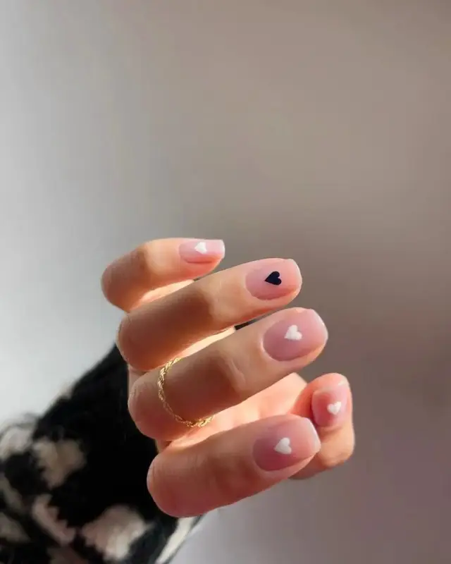 Light Peach Nails with Glittered Heart Highlights