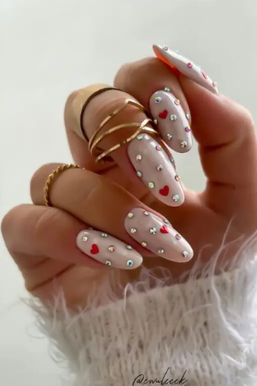 Bold Red Glitter Nails with Jewel Accents