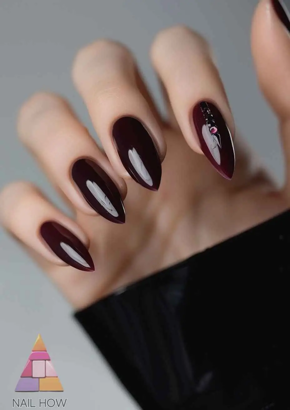 Glossy Plum Nails with Rhinestone Details