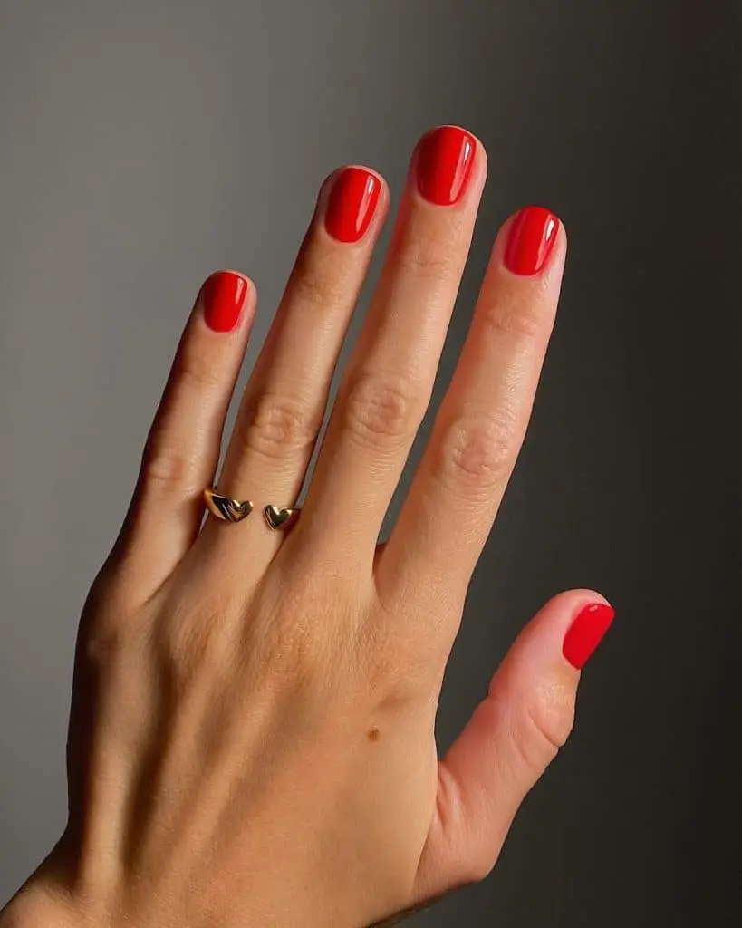 Soft pearl white nails with a glossy sheen and subtle shimmer
