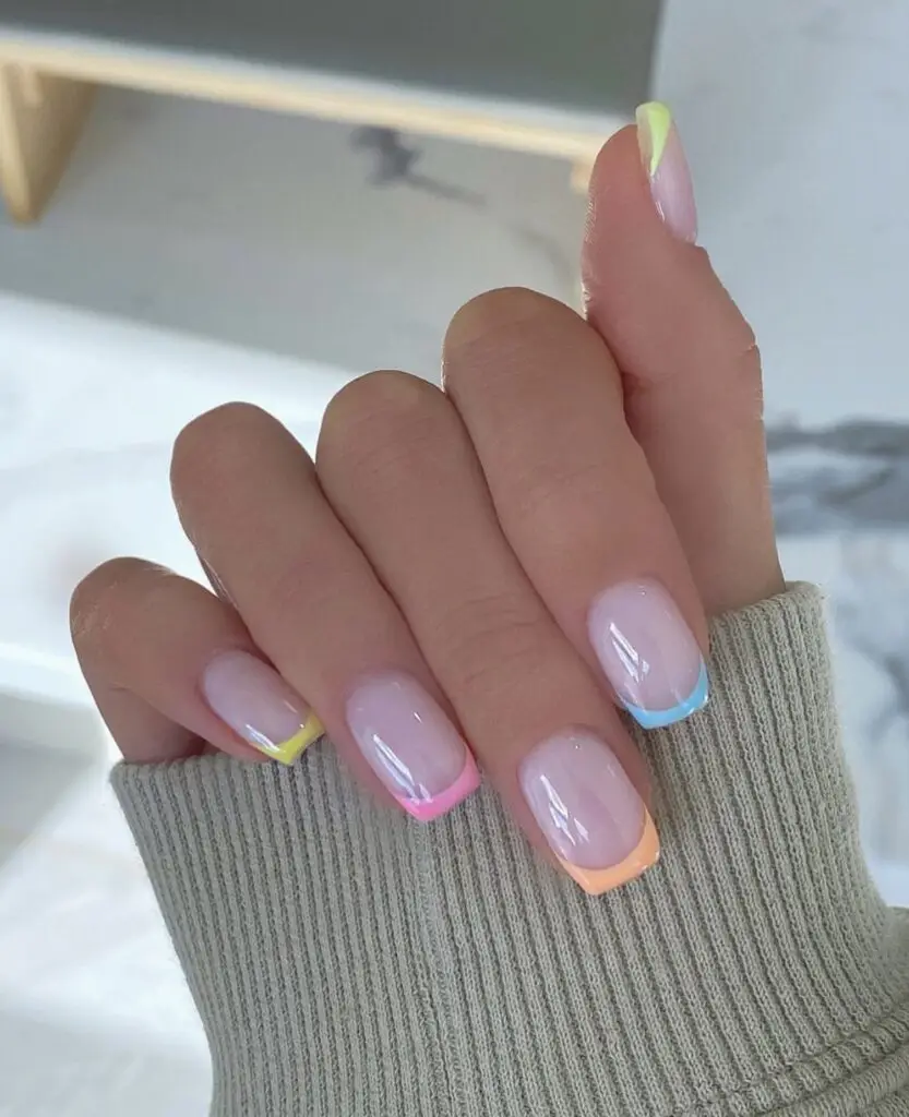 Pastel-toned floral design on short acrylic nails