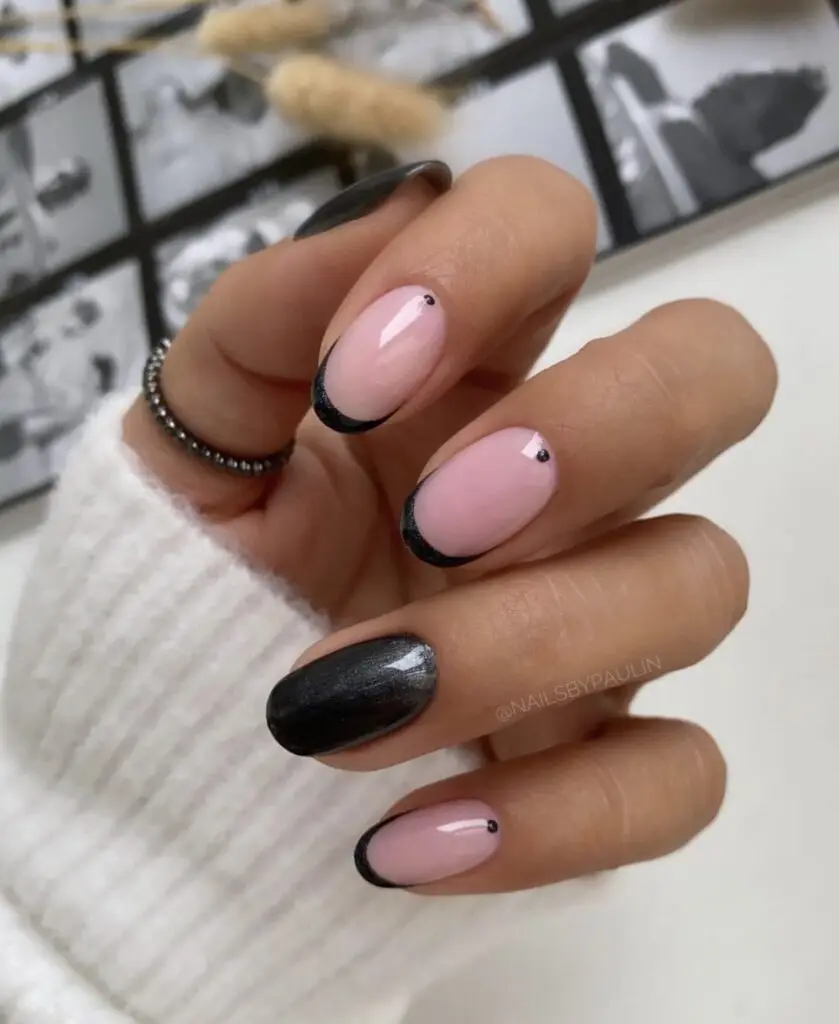 Short acrylic nails in milky white with delicate gold accent details