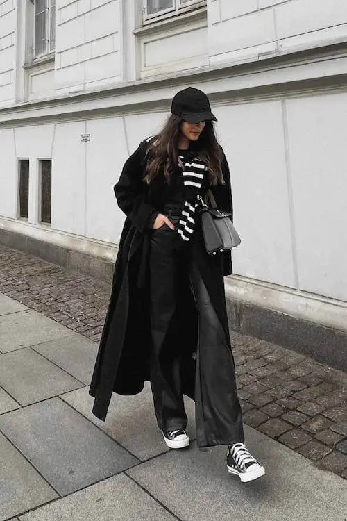 Casual winter outfit featuring a beige coat and sneakers