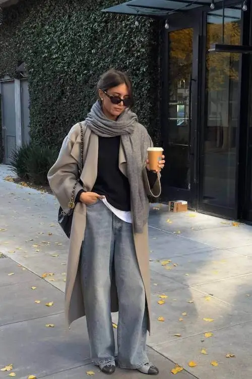 Minimalist winter outfit featuring a beige coat and knit scarf