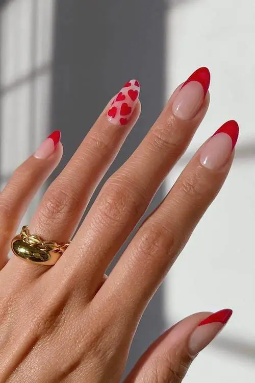 Valentine’s Day nails with red, pink, and white diagonal stripes