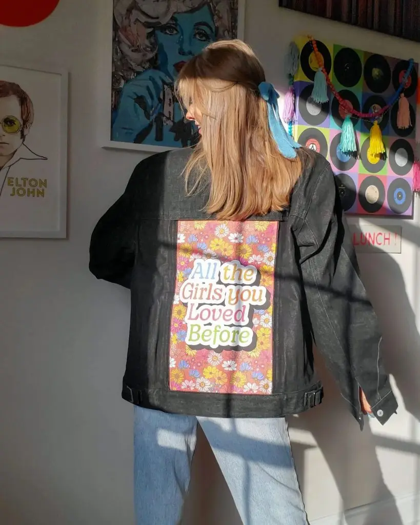 Jean jacket with wildlife-themed embroidery on the back and cuffs