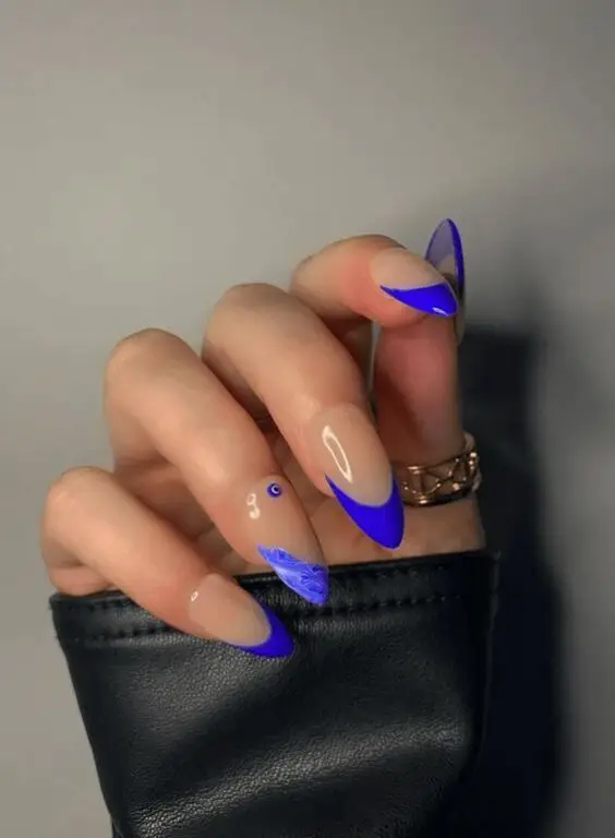 Bold Coral Spring Nail Design with Abstract Patterns