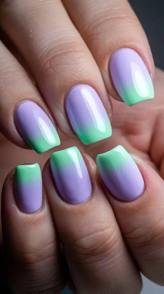 Short jewel-toned acrylic nails with glitter accents