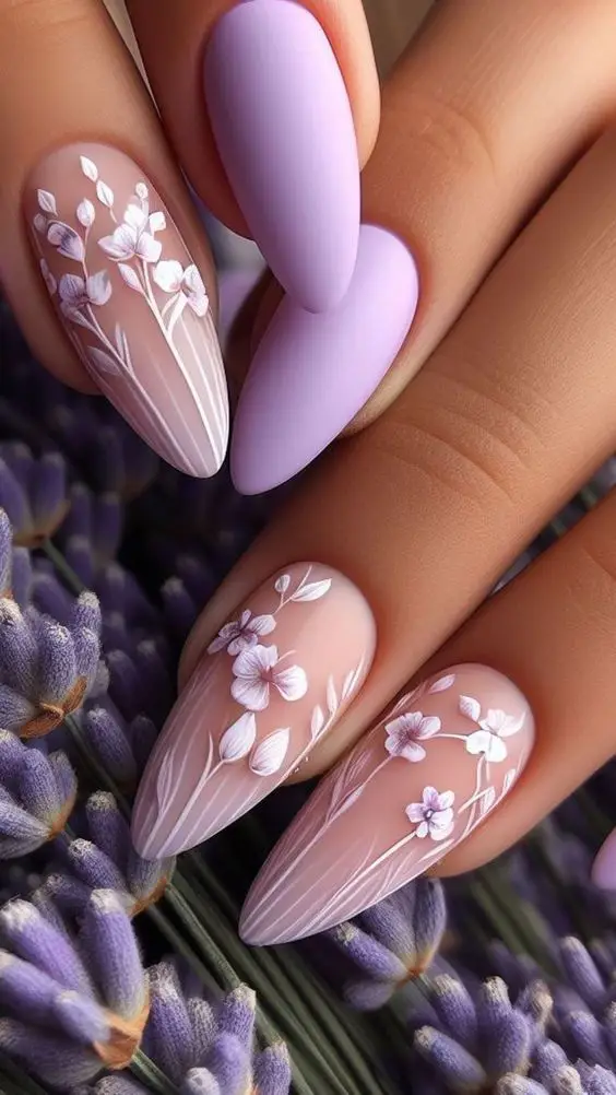 Short pink acrylic nails with abstract white wave designs