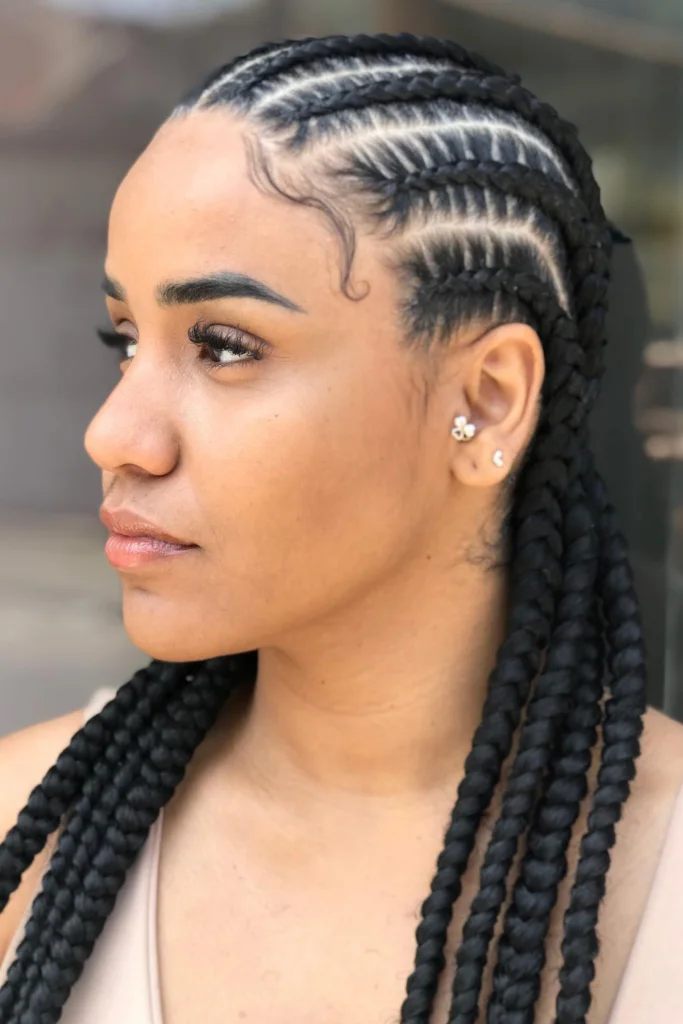 Alicia Keys with mid-length braids featuring caramel highlights