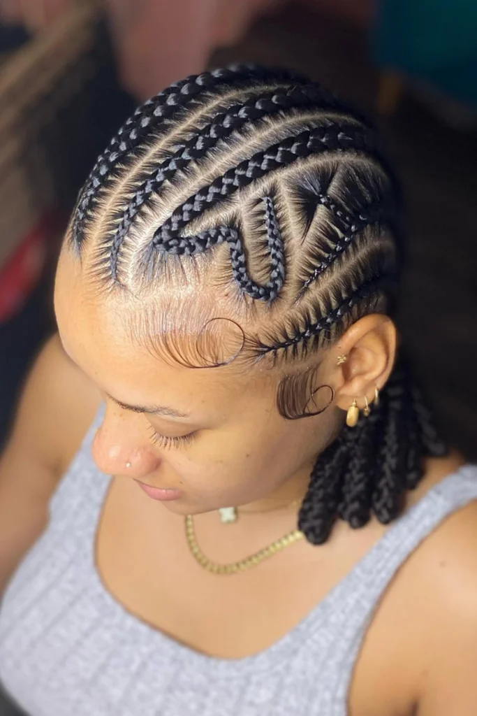 Alicia Keys in a sleek braided updo with intricate patterns