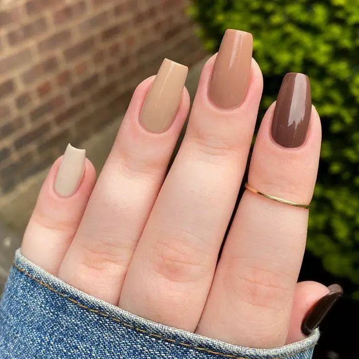 Red poppy nail art on nude base
