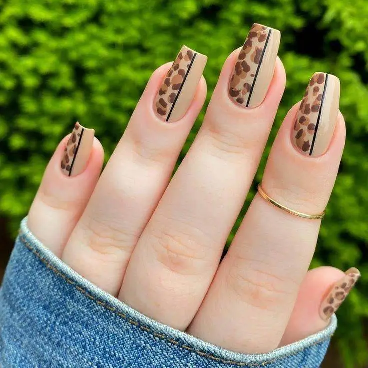 Citrus-inspired dot nail art in bright tones