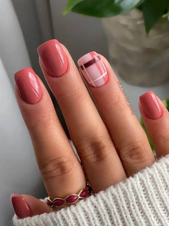 Bold floral nail design with gradient background