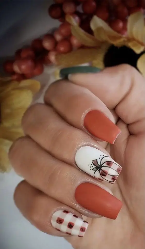 Vibrant short tangerine acrylic nails with a glossy finish