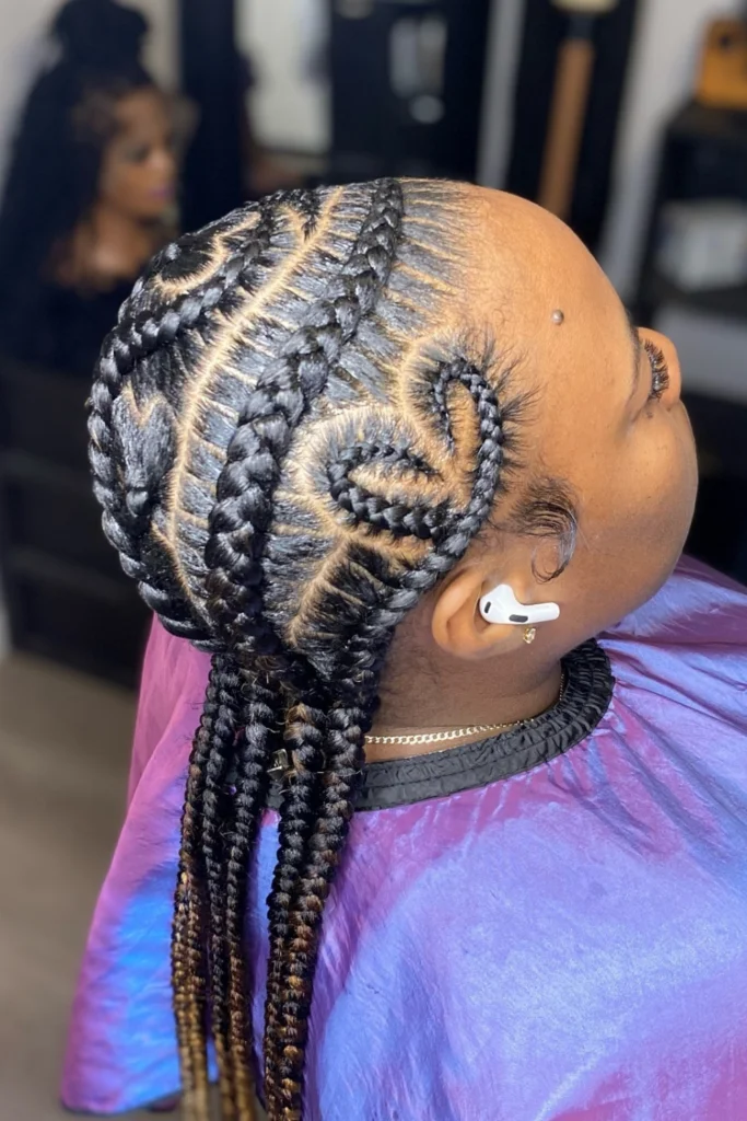 Alicia Keys with intricate scalp braids and decorative beads at the ends