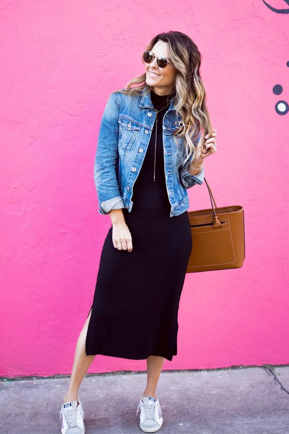Oversized denim jacket styled with graphic layers for urban flair