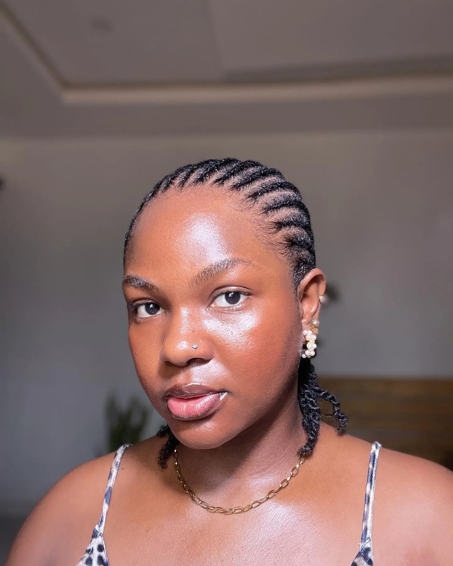 All-back minimalist goddess cornrows emphasizing natural hair texture