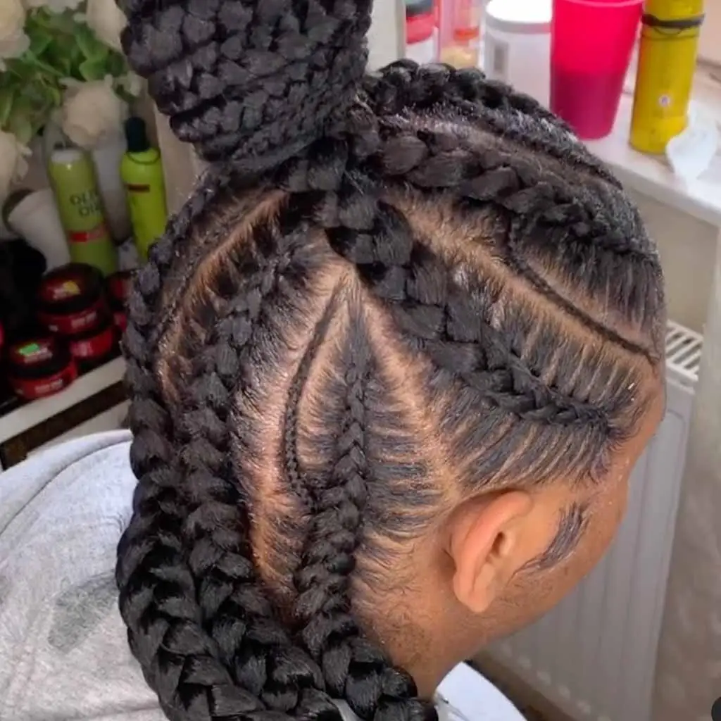 Goddess cornrows with spiral parting and flowing curls