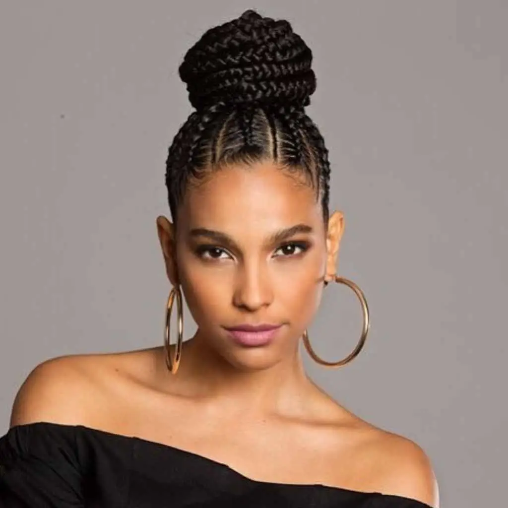 Interwoven goddess cornrows leading into a high bun