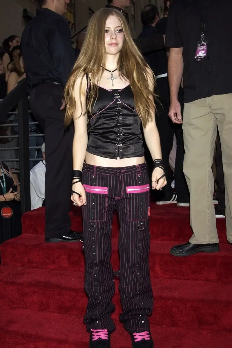 Pop-punk ensemble inspired by Avril Lavigne with plaid and studded accessories.