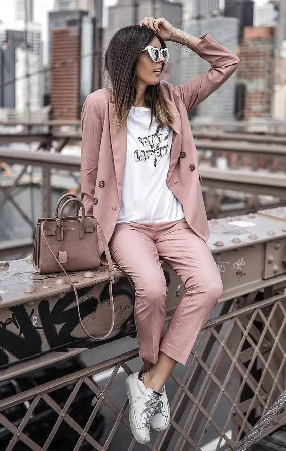 Business casual look featuring a relaxed suit and white sneakers