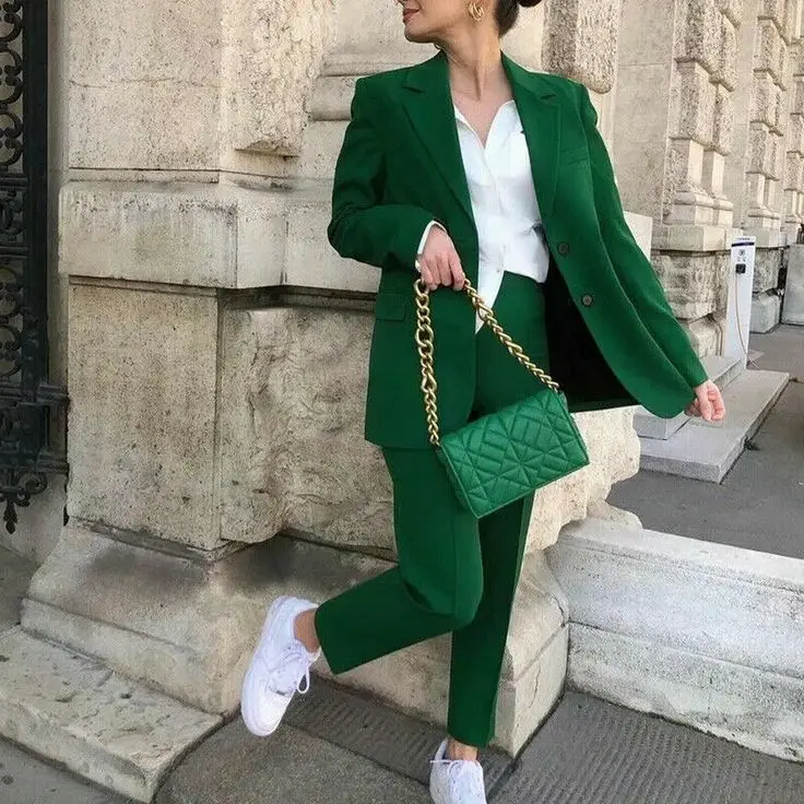Business casual outfit with a printed blouse and pleated skirt