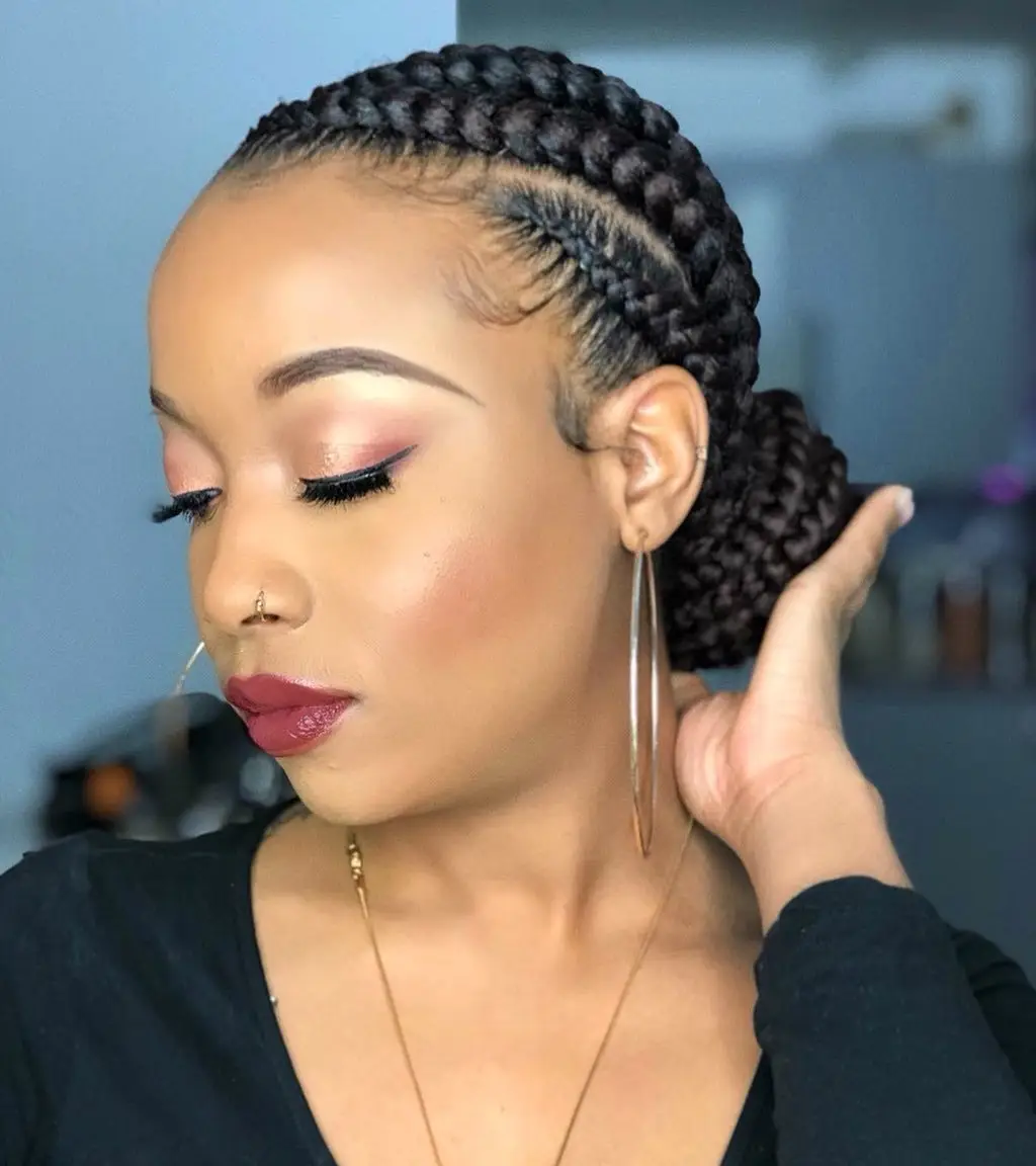 Bold geometric goddess cornrows with sharp angles and intricate patterns