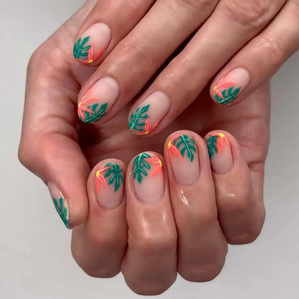 Neutral nails with subtle petal-shaped details